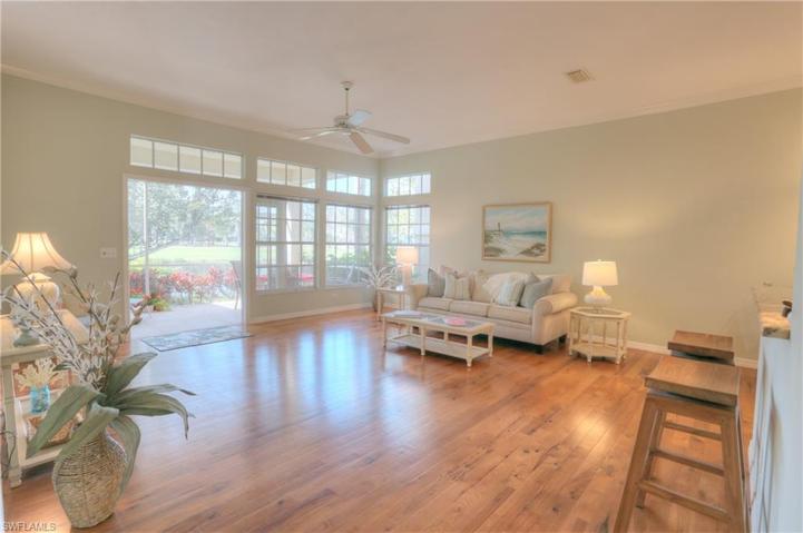 Great Room Looks Out To Lanai, Lake and Golf Course