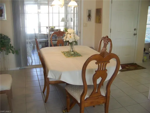 Formal dining room. "French door" look sliders to lanai in background.