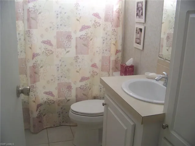 Guest bathroom, has glass block above tub/shower combo.