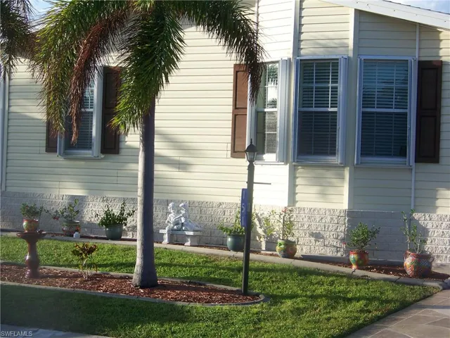 Close up of front of home. Decor exterior shutters.