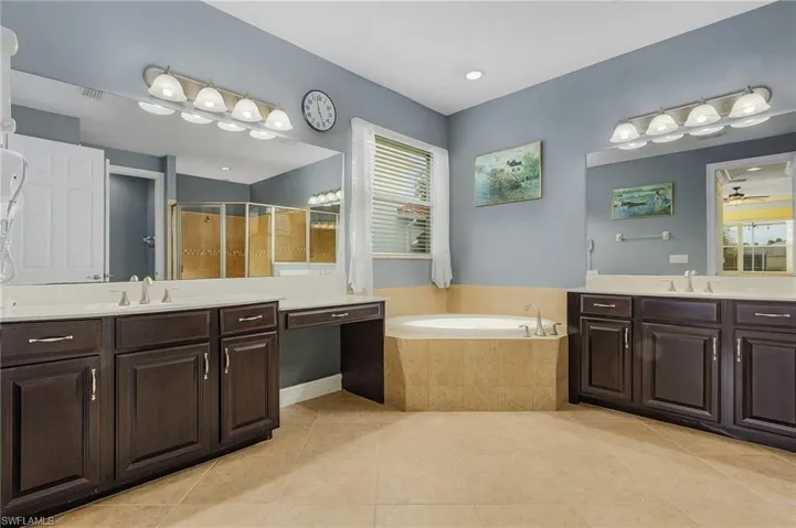 HIS AND HERS VANITIES AND SOAKING TUB