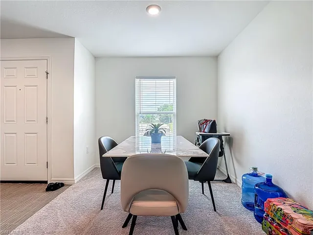 Dining room with light carpet