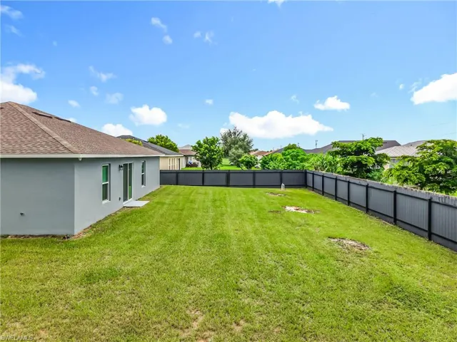 View of fenced backyard