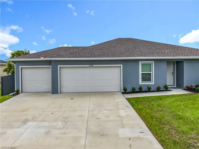 Ranch-style home featuring roof with shingles, an attached garage, stucco siding, and concrete driveway