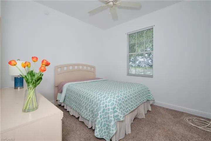 Bedroom featuring carpet floors and ceiling fan