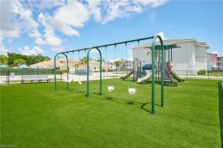 View of play area with a yard