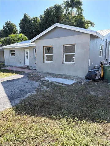 View of front of house with a front yard