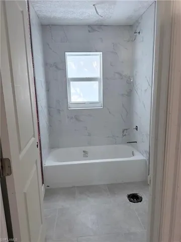 Bathroom with washtub / shower combination