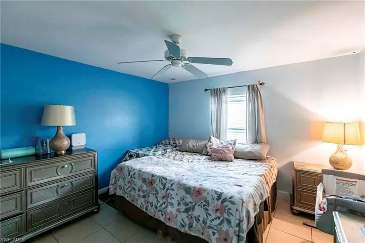 Bedroom featuring a ceiling fan and light tile patterned floors