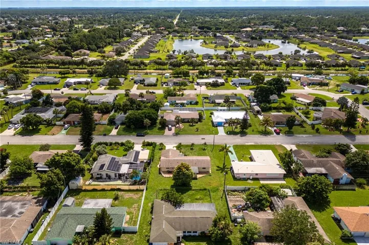 View of property location with nearby suburban area and a nearby body of water
