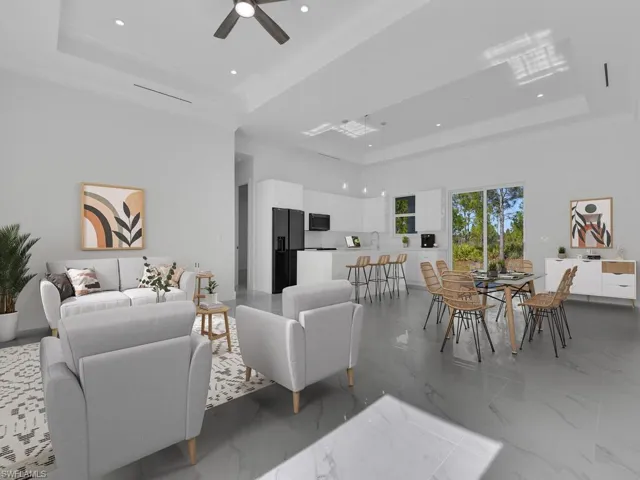 Living room with a raised 10' ceiling  and ceiling fan. Furnitures are not included.