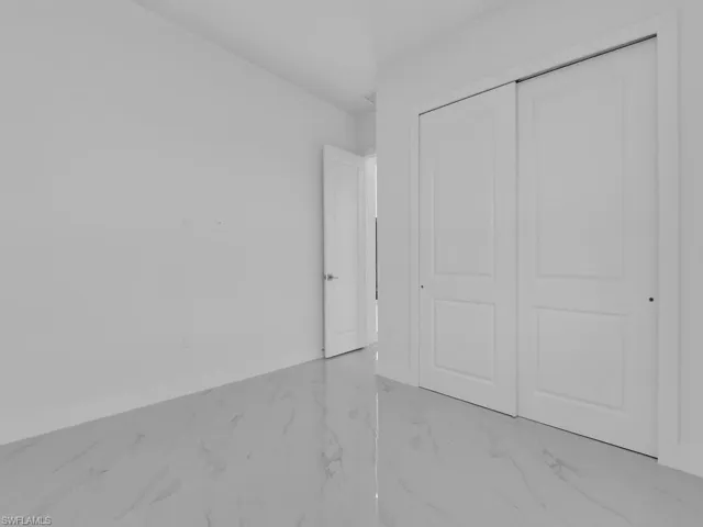Unfurnished bedroom # 2 featuring a closet.