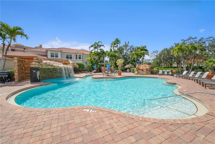 Community pool with a patio area