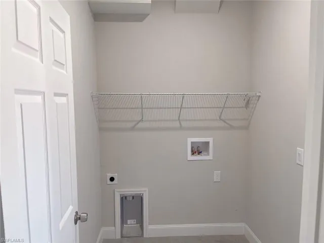 Laundry area featuring hookup for an electric dryer and washer hookup