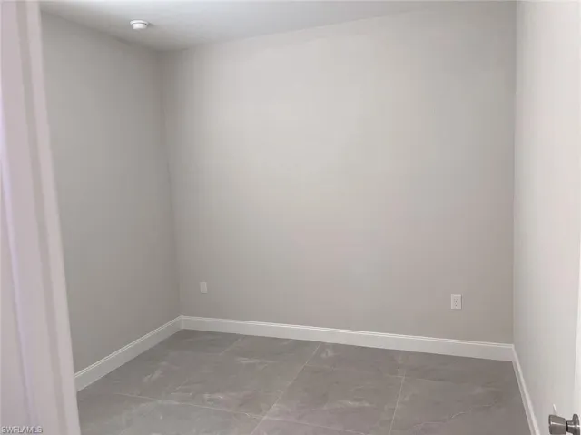 Spare room with tile patterned floors