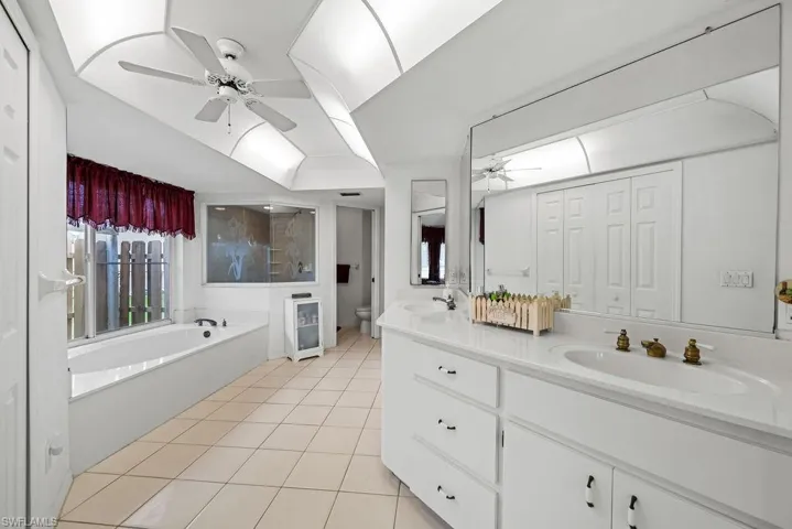 Primary bathroom with separate shower, tub and dual sinks.