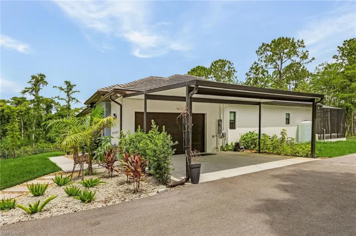 View of front facade featuring a carport