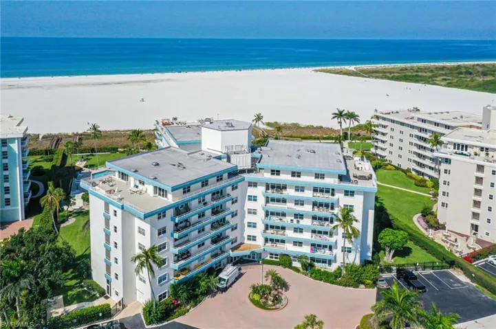 Drone / aerial view featuring a water view and a view of the beach