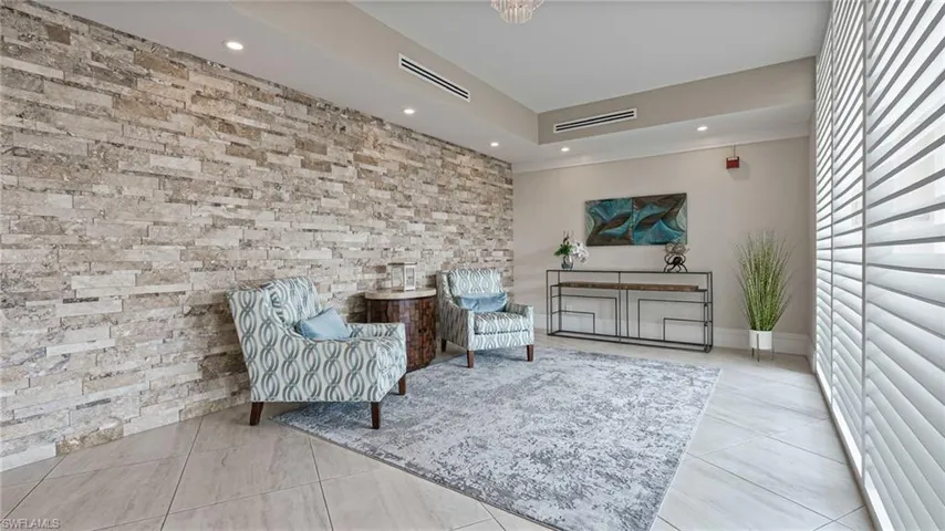 Living area featuring light tile patterned floors