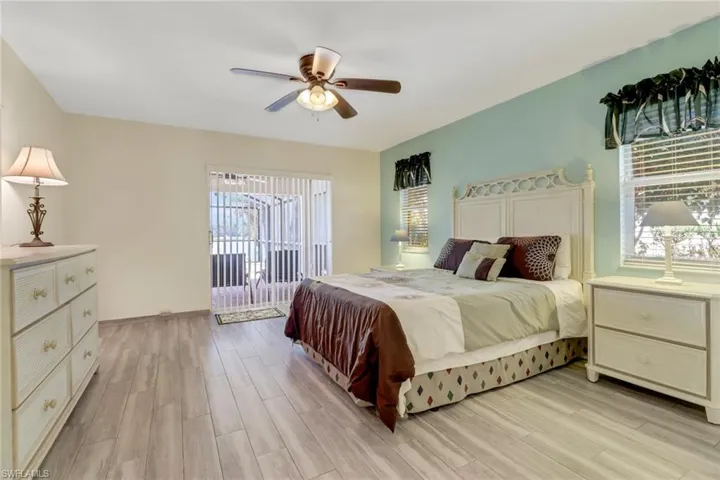This inviting room features light wood-look flooring and a light blue accent wall