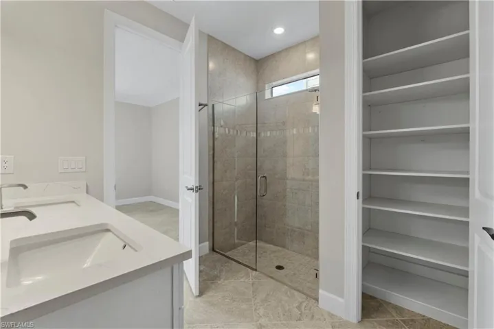 Dual vanity with undermount sinks and light-toned countertops