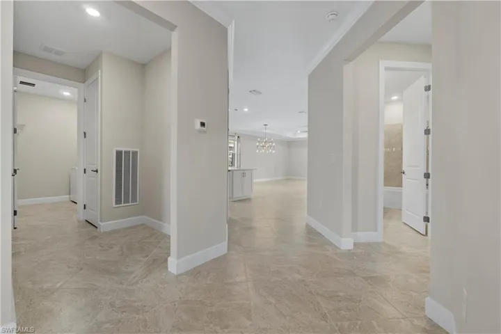 Neutral-toned tile flooring throughout