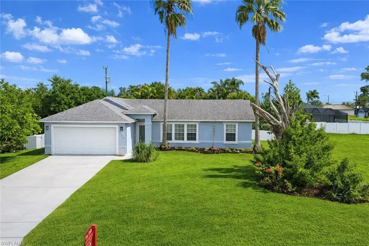 Ranch-style house featuring stucco siding, concrete driveway, a garage, and roof with shingles