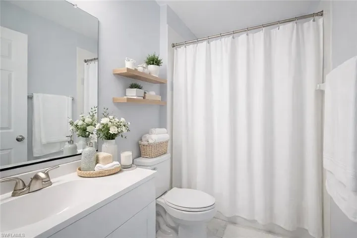 Bathroom with vanity and toilet