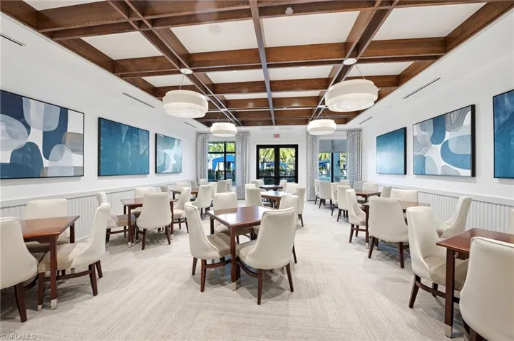 Coffered wood-beam ceiling, drum pendant lighting, and neutral wainscoting