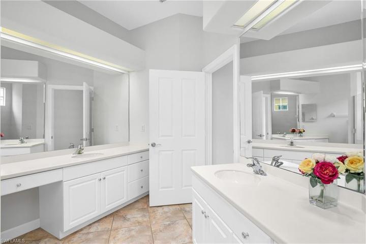 Large owner's bathroom includes dual sinks and walk in shower.