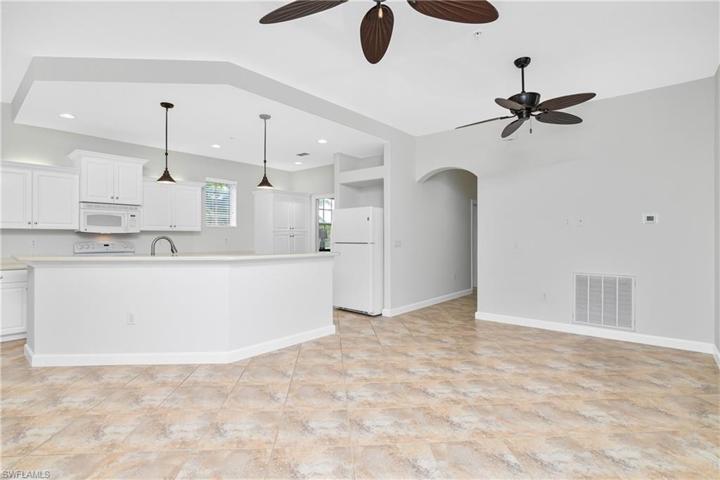 This beautifully designed open floor plan features tile flooring a and freshly painted interior.
