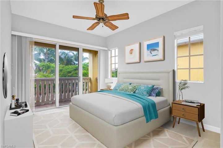 Large master suite includes a private balcony with sliding glass doors, ceiling fan and walk-in closet. (photo digitally staged)
