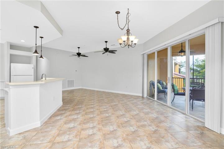 This home has plenty of space to entertain guests... from the kitchen island to the dining table, family room, and oversize lanai!