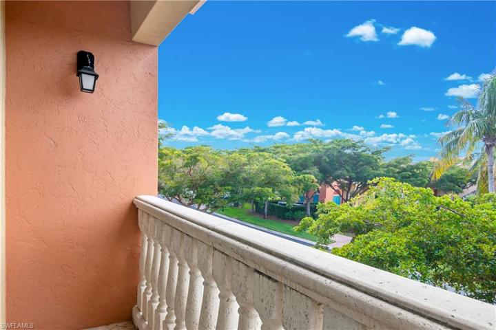 Juliet Balcony from Owner Bedroom offers views of the community pool.