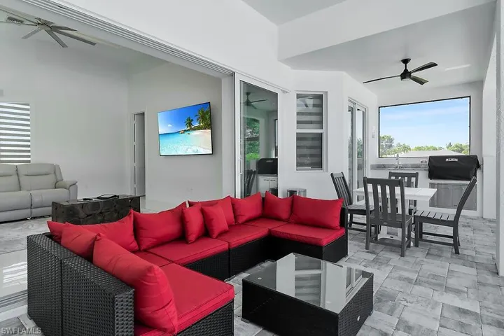 View of patio / terrace featuring a ceiling fan, an outdoor hangout area, and grilling area