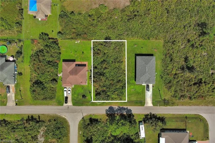 Aerial overview of property's location featuring property parcel outlined