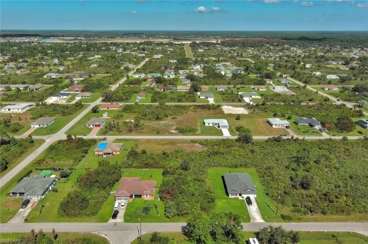 View of property location with nearby suburban area