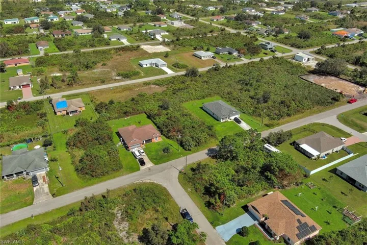 View of property location with nearby suburban area