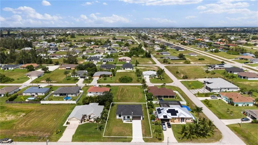 Aerial perspective of suburban area with property boundaries highlighted