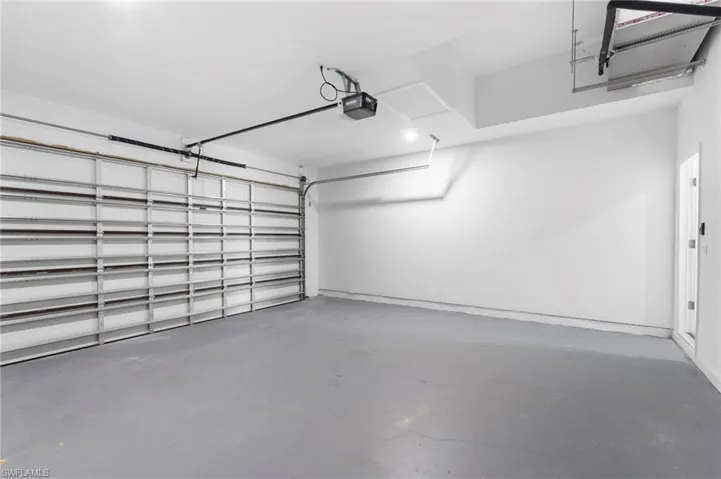 Garage featuring a garage door opener