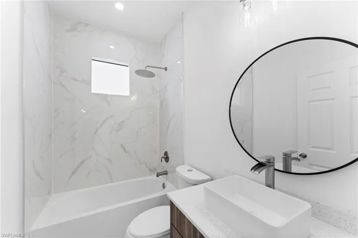 Bathroom featuring bathing tub / shower combination and vanity