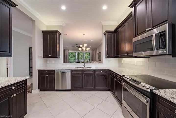 Kitchen has ample cabinet space with pull out interiors.