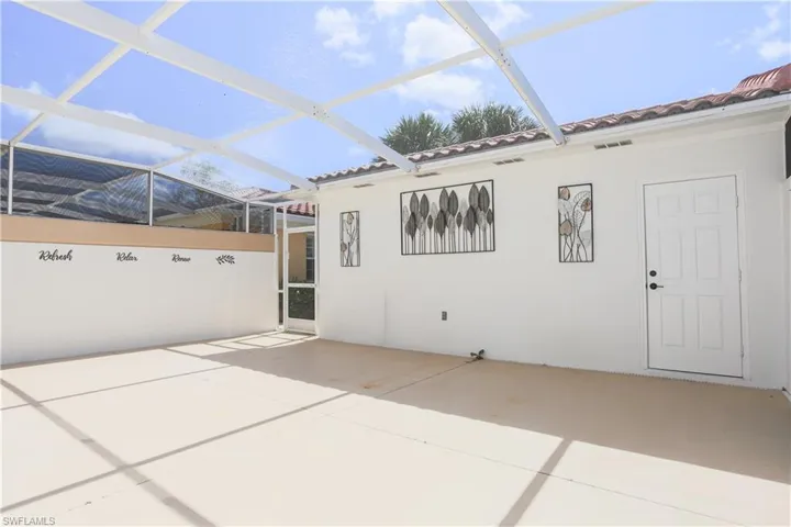 View of patio / terrace with glass enclosure and a sunroom