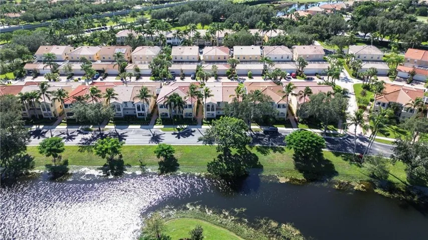 Aerial view of property's location with a large body of water