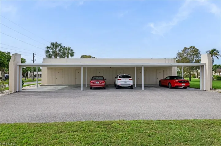 Carport and storage at end of building