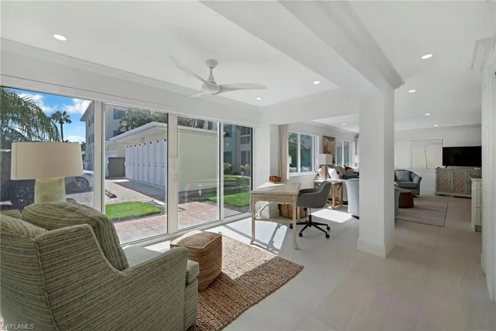 Sunroom / solarium with plenty of natural light and ceiling fan