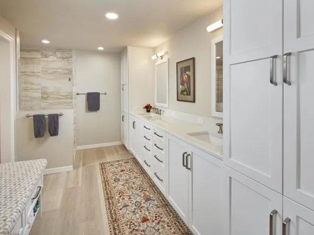 Ensuite bathroom with dual sinks, plenty of storage and a walk in shower.