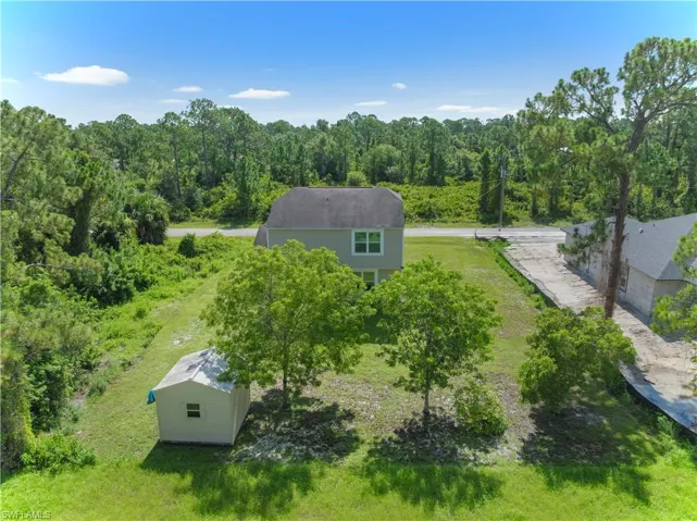 View from above of property with a heavily wooded area