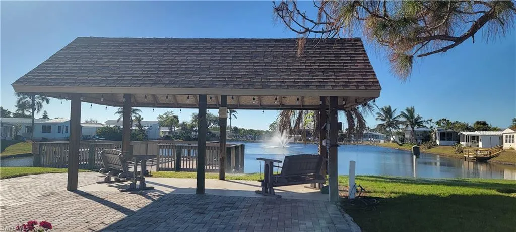 View of community with a gazebo, a water view