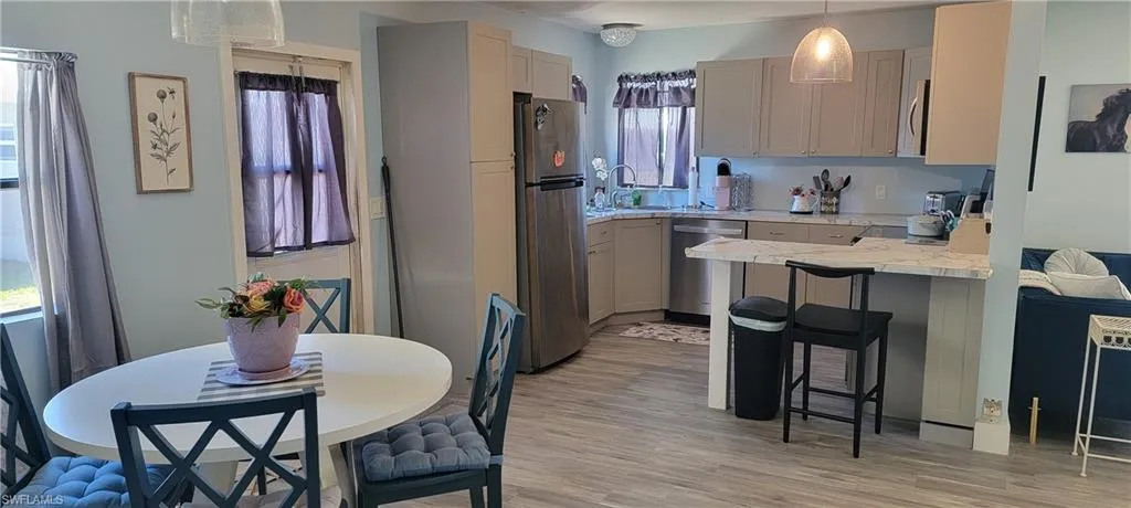 Kitchen  / dining room combination,  light colored floors